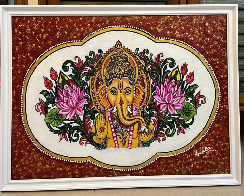 Lord Ganesha surrounded by pink lotuses and foliage on a maroon-and-gold background, in a white frame.