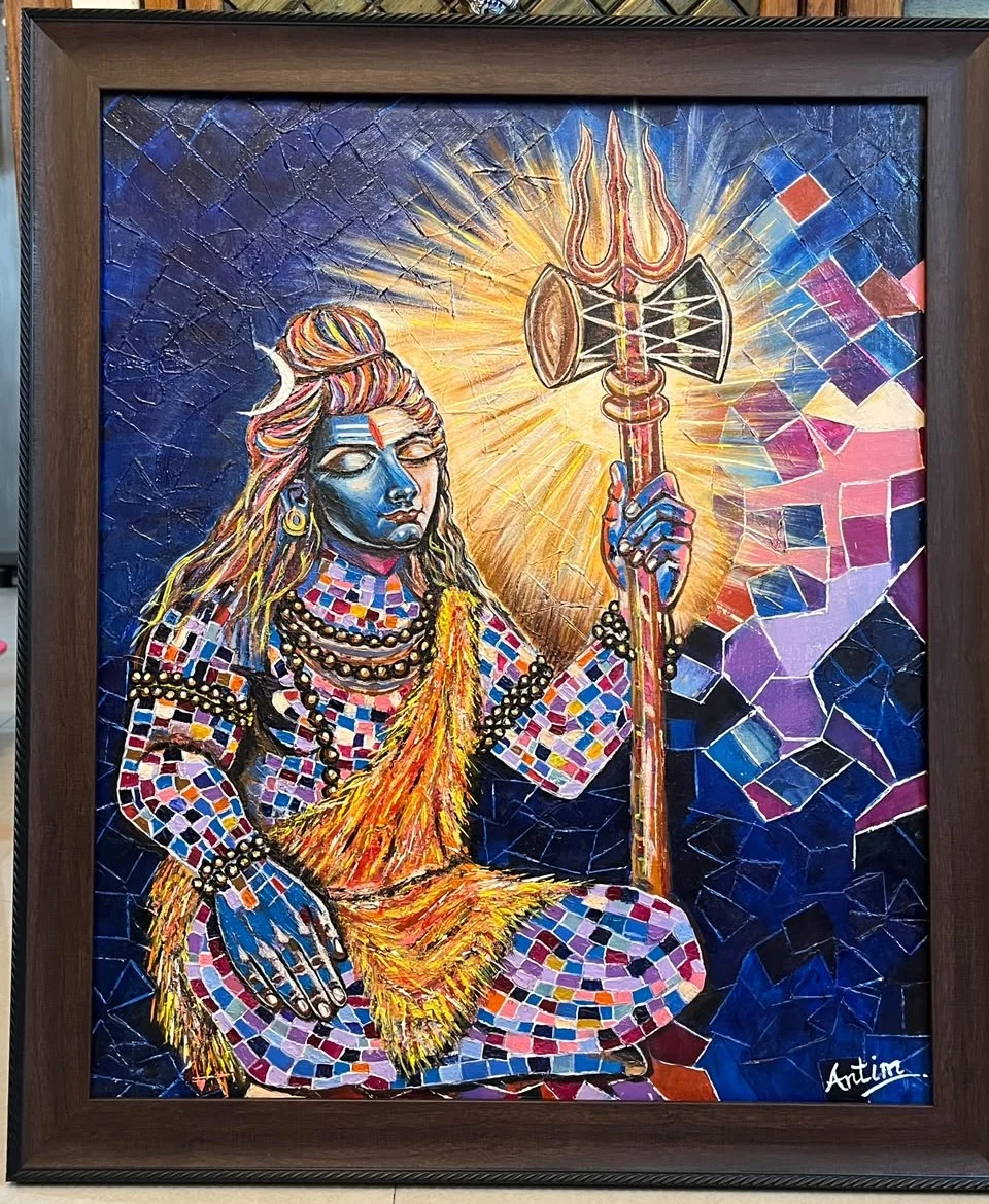 Lord Shiva holding a trident and drum, with a golden aura and colourful mosaic patterns against blue, in a dark frame.